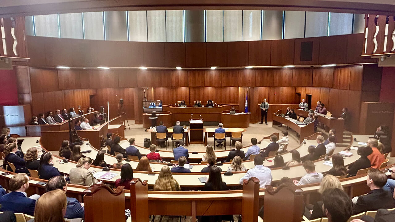 Hundreds of people sit in Quinnipiac ceremonial courtroom