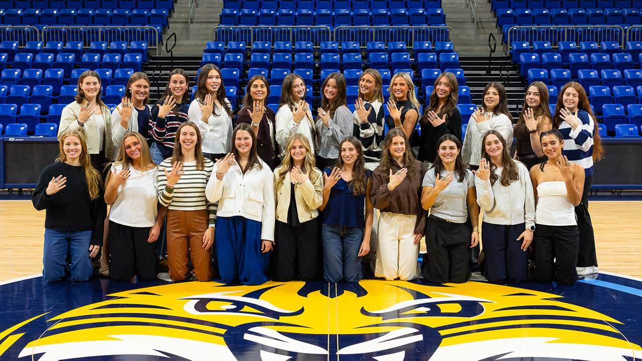 Women's Ice Hockey team with their ECAC Championship rings.